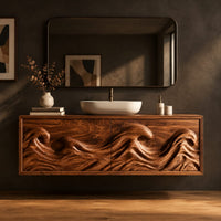 Floating bathroom vanity with deeply carved ocean wave doors in a dark studio against a charcoal plaster wall