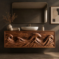 Corner detail of floating bathroom vanity with deeply carved ocean wave doors beside wood, brass and linen samples