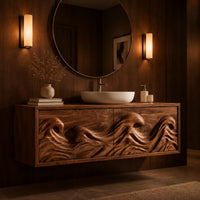 Floating bathroom vanity with deeply carved ocean wave doors in an evening bathroom with walnut wall paneling