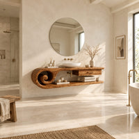 Floating vanity cabinet with a carved scroll end and a small drawer in a bright open plan bathroom