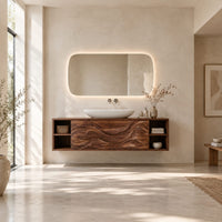Floating bathroom vanity with carved wave doors and open end shelves in a bright open plan bathroom