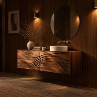 Floating bathroom vanity with wave carved drawer fronts in an evening bathroom with walnut wall paneling