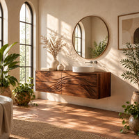 Floating bathroom vanity with wave carved drawer fronts in a bright bathroom with arched windows and plants