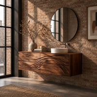 Floating bathroom vanity with wave carved drawer fronts in an industrial loft bathroom with exposed brick