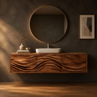 Floating bathroom vanity with three carved wave fronts in a dark studio against a charcoal plaster wall