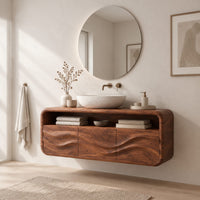 Floating vanity cabinet with carved wave fronts and an open top niche in a Scandinavian bathroom with white walls
