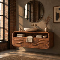 Floating vanity cabinet with carved wave fronts and an open top niche in an industrial loft bathroom with exposed brick