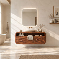 Floating vanity cabinet with carved wave fronts and an open top niche in a bright open plan bathroom