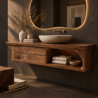 Corner detail of floating wooden vanity cabinet with flared ends and an open shelf beside wood, brass and linen samples
