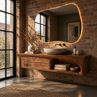 Floating wooden vanity cabinet with flared ends and an open shelf in an industrial loft bathroom with exposed brick