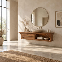 Floating wooden vanity cabinet with flared ends and an open shelf in a bright open plan bathroom