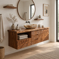 Floating wooden vanity cabinet with leaf and wave carved fronts and an open niche in a Scandinavian bathroom with white walls