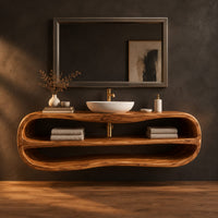 Floating oval vanity cabinet with a looping rim and two open shelves in a dark studio against a charcoal plaster wall