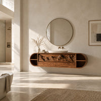 Pill shaped floating cabinet with carved mountain front and open end cubbies in a bright open plan bathroom