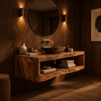 Floating wooden bathroom vanity with a slab top and an open shelf below in an evening bathroom with walnut wall paneling