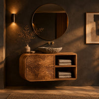 Floating bathroom vanity with rippled drawers and open shelves in a dark bathroom at golden hour