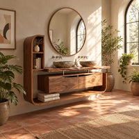 Floating bathroom vanity cabinet with a side shelf tower and open lower shelf in a bright bathroom with arched windows and plants