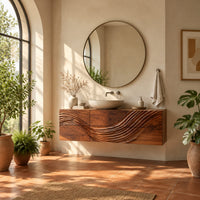 Floating bathroom vanity with a wave carved across six panels in a bright bathroom with arched windows and plants
