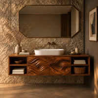 Corner detail of floating bathroom vanity with wave carved center and open side cubbies beside wood, brass and linen samples