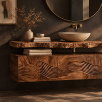 Corner detail of floating wood cabinet with wave carved fronts and a live edge slab top beside wood, brass and linen samples