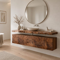 Floating wood cabinet with wave carved fronts and a live edge slab top in a Scandinavian bathroom with white walls
