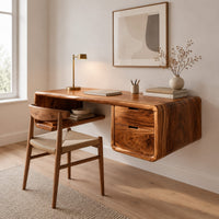 Floating desk with a soft edged body, open cubby shelf and two drawers in a Scandinavian home office with white walls