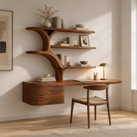 Wall hung desk with branching tree shaped shelves and a wave carved box in a Scandinavian home office with white walls
