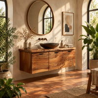 Floating wood cabinet with three doors and a live edge top in a bright bathroom with arched windows and plants