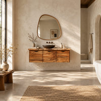 Floating wood cabinet with three doors and a live edge top in a bright open plan bathroom
