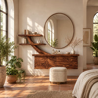 Floating makeup vanity with a branch shaped arm and two small shelves in a bright bedroom with arched windows and plants