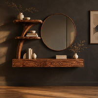 Floating makeup vanity with a low three panel front and a tree stem shelf in a dark studio against a charcoal plaster wall