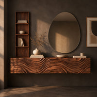 Corner detail of floating makeup vanity with a carved wave front and a tall open shelf beside wood, brass and linen samples