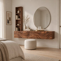 Floating makeup vanity with a carved wave front and a tall open shelf in a Scandinavian bedroom with white walls