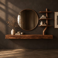 Corner detail of floating wood makeup vanity with a circular mirror and a branch shaped tiered shelf beside wood, brass and linen samples