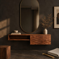 Corner detail of floating makeup vanity with an open niche and a wave carved front panel beside wood, brass and linen samples