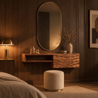 Floating makeup vanity with an open niche and a wave carved front panel in an evening bedroom with walnut wall paneling