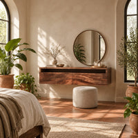 Floating makeup vanity with an open top niche and two wave grain fronts in a bright bedroom with arched windows and plants