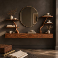 Corner detail of floating makeup vanity with a long panelled front and two branch shelf stands beside wood, brass and linen samples