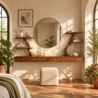 Floating makeup vanity with a long panelled front and two branch shelf stands in a bright bedroom with arched windows and plants