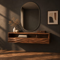 Floating makeup vanity with an open top shelf and two wave carved fronts, three-quarter view showing the grain