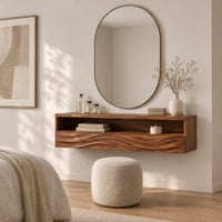 Floating makeup vanity with an open top shelf and two wave carved fronts in a Scandinavian bedroom with white walls