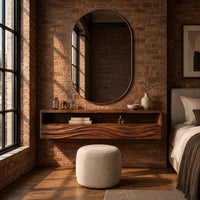 Floating makeup vanity with an open top shelf and two wave carved fronts in an industrial loft bedroom with exposed brick