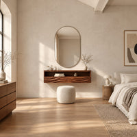 Floating makeup vanity with an open top shelf and two wave carved fronts in a bright open plan bedroom