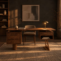 Desk with a floating top over two raised drawer cabinets in a dark home office at golden hour