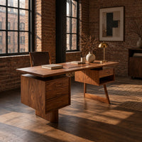 Desk with a floating top over two raised drawer cabinets in an industrial loft home office with exposed brick