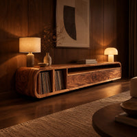Low floating tv stand with open vinyl slots and two wide front panels in an evening living room with walnut wall paneling