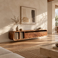 Low floating tv stand with open vinyl slots and two wide front panels in a bright open plan living room