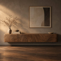 Corner detail of floating tv stand with swirling tree ring carved fronts beside wood, brass and linen samples
