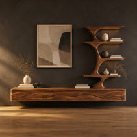 Floating media stand with wave carved fronts and a sculptural tiered shelf tower in a dark studio against a charcoal plaster wall