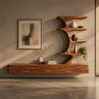 Corner detail of floating media stand with wave carved fronts and a sculptural tiered shelf tower beside wood, brass and linen samples